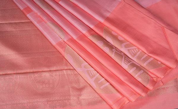 Peach kanchipuram silk saree with border bhuttas flaunting copper coin
