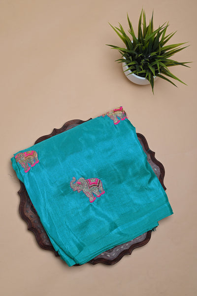 PALAM-SILKS-Borderless Sky Blue Semi Tussar Saree with embroidered elephant motifs taking over one half of the saree.